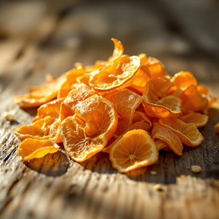 A hyperrealistic close-up of dried orange peels, rich orange-brown and curled, illuminated by warm golden sunlight, with fine oil droplets glistening on their textured, waxy surfaces. The background is a blurred rustic wooden surface, evoking a serene, spa-like atmosphere for a candle fragrance note.