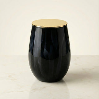 Earth’s Embrace Feng Shui earth element luxury candle in glossy obsidian black glass with elegant gold lid on ivory background