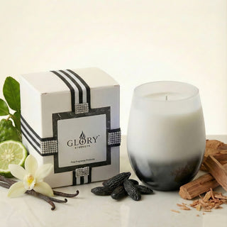 Elegant Whisper Feng Shui metal element luxury candle in white-to-smoke ombré glass styled with tonka bean, vanilla orchid, sandalwood and GLORY STRENGTH gift box