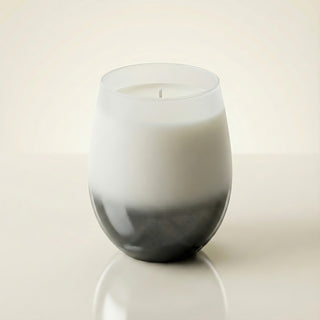 Elegant Whisper Feng Shui metal element luxury candle in frosted white-to-smoke ombré glass vessel on clean ivory background