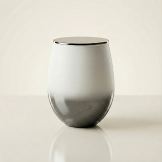Elegant Whisper Feng Shui metal element luxury candle in glossy white-to-smoke ombré glass with polished silver lid