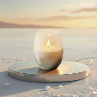 Elegant Whisper Feng Shui metal element luxury candle lit on metallic pedestal with scattered diamonds during  golden-hour