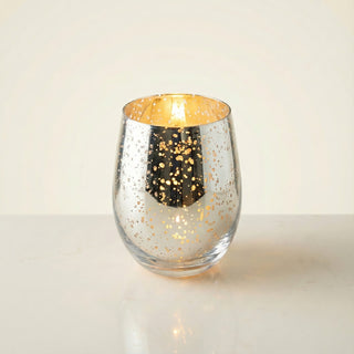 Legacy Collection Today flagship luxury candle lit with golden flame in gold-flecked silver mercury glass vessel
