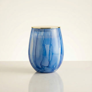 Azure Coastal Bliss Feng Shui water element luxury candle in hand-painted blue marbled glass with elegant gold lid on ivory background