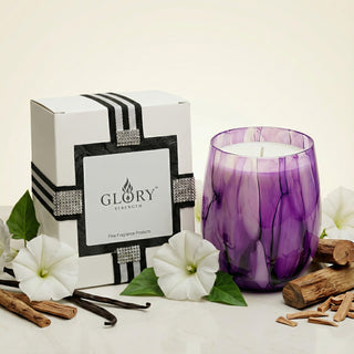 Enigmatic Bloom Feng Shui wood element luxury candle in purple marbled glass styled with moonflowers, sandalwood, vanilla beans and GLORY STRENGTH gift box